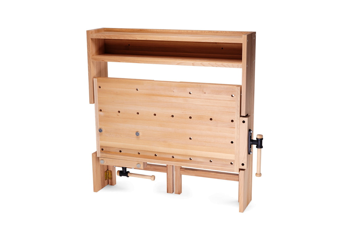 RAMIA wall-mounted workbench folded against the wall